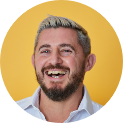 An image of the director of Kasa Chiropractic located in Bristol, Matt Poulter. Matt has naturally short, dark hair with frosted blonde tips. He has facial hair and is smiling.